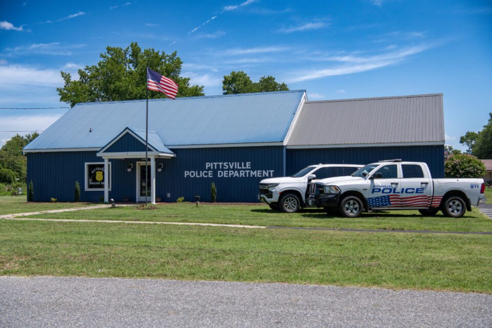 Photo of Pittsville Police Department with vehicles.